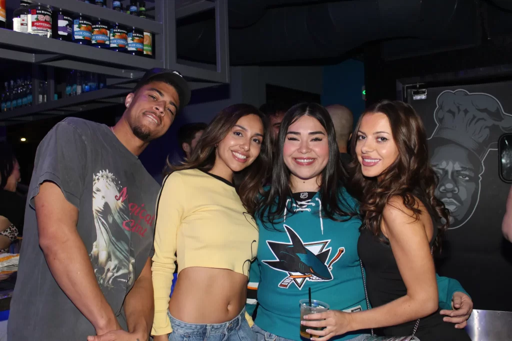 A group of friends together inside Audio Bar