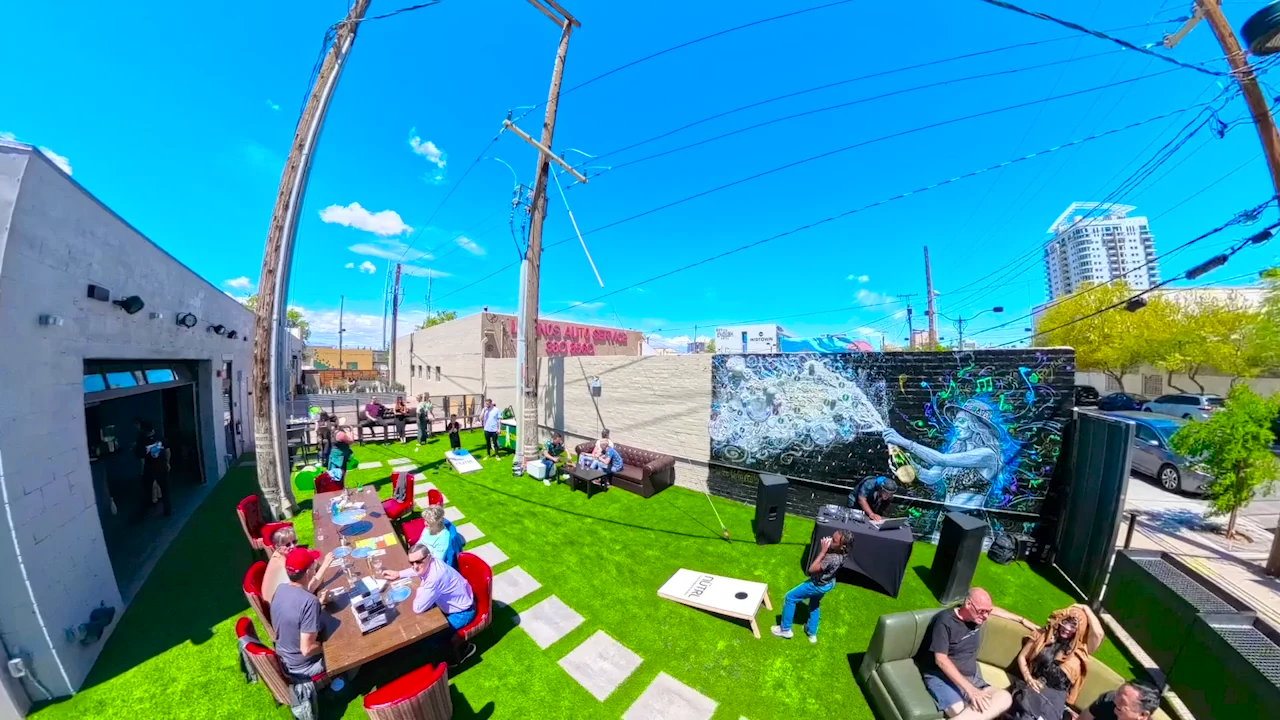 Audio Bar’s open courtyard connects the outdoor tables, colorful mural, and indoor venue